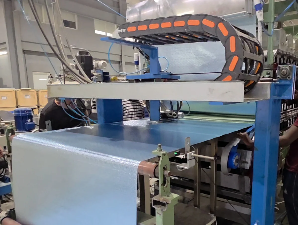 Polyurethane panel production machinery in operation